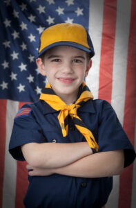 Boy, age 7, in scout uniform.